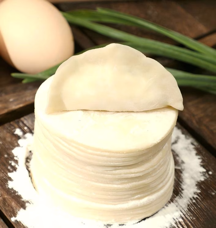 How should dumpling wrappers be frozen?